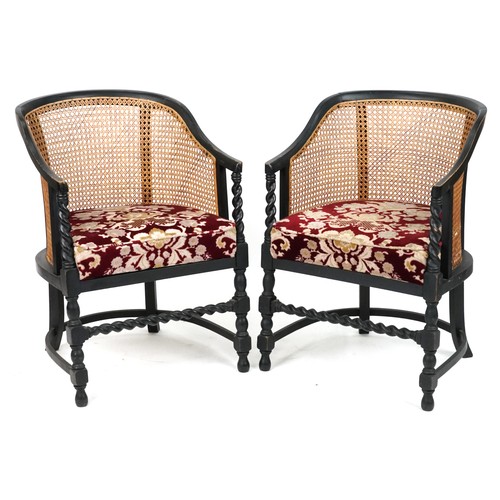 1134 - Pair of Victorian ebonised barley twist bergère tub chairs with floral upholstered cushioned seats, ... 