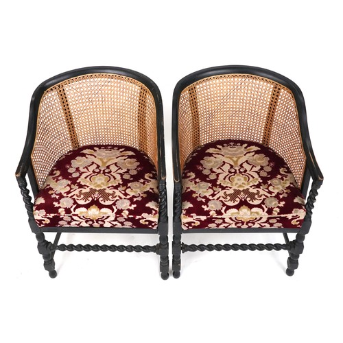 1134 - Pair of Victorian ebonised barley twist bergère tub chairs with floral upholstered cushioned seats, ... 