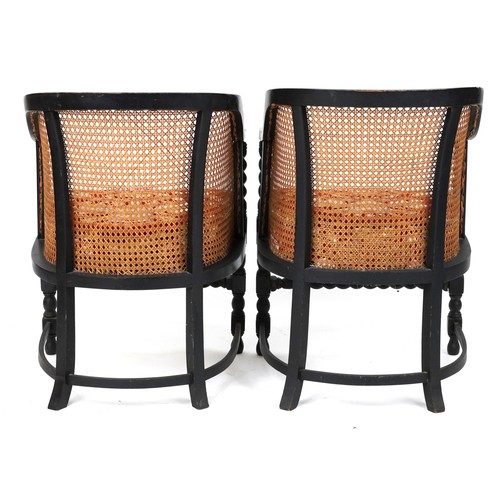 1134 - Pair of Victorian ebonised barley twist bergère tub chairs with floral upholstered cushioned seats, ... 