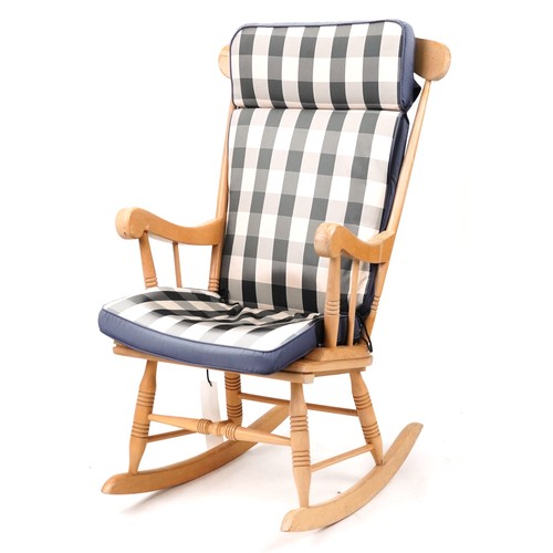 1144 - Lightwood rocking chair with check upholstered cushions, 102cm high