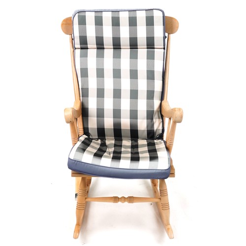 1144 - Lightwood rocking chair with check upholstered cushions, 102cm high