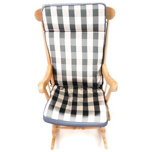 1144 - Lightwood rocking chair with check upholstered cushions, 102cm high