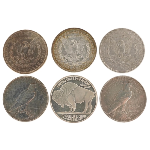 2104 - Six 19th century and later United States of America silver dollars including dates 1884, 1886, 1921 ... 