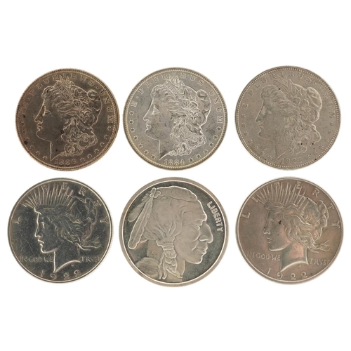 2104 - Six 19th century and later United States of America silver dollars including dates 1884, 1886, 1921 ... 