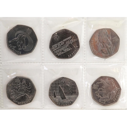 2192 - Set of thirty Elizabeth II 2011 London 2012 Olympics fifty pence pieces arranged in a coin collectio... 