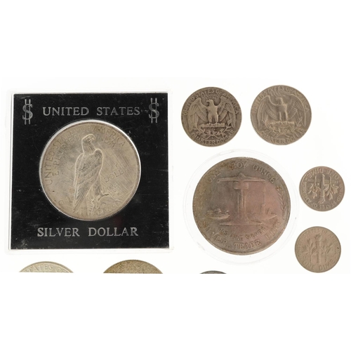 2107 - United States of America coinage including 1923 silver dollar, half dollars and quarter dollars