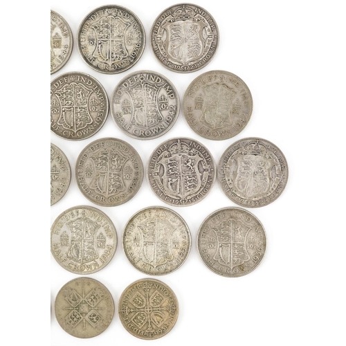 2097 - Twenty George V and later half crowns and three florins, 310g