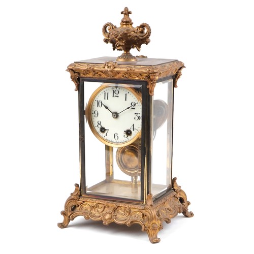 19th century ormolu four glass mantle clock striking on a gong with urn finial and circular enamelled dial having Arabic numerals, 40cm high