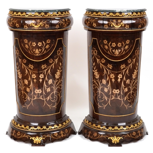 1039 - Pair of French Louis XV style walnut effect demi lune pedestals with gilt metal mounts, marble tops ... 