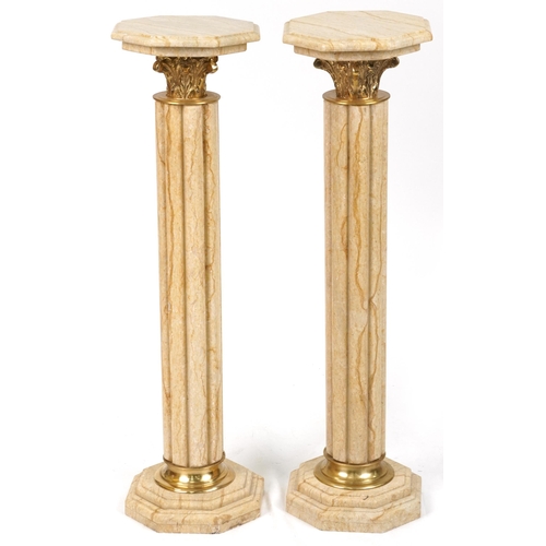 1067 - Pair of classical Travertine marble pedestal columns with gilt metal mounts, each 103cm high