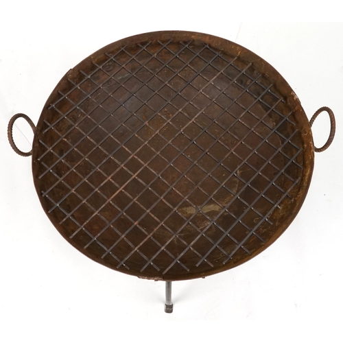 1215 - Cast metal firepit with twin handles and grill on tripod stand, 50cm high x 90.5cm in diameter