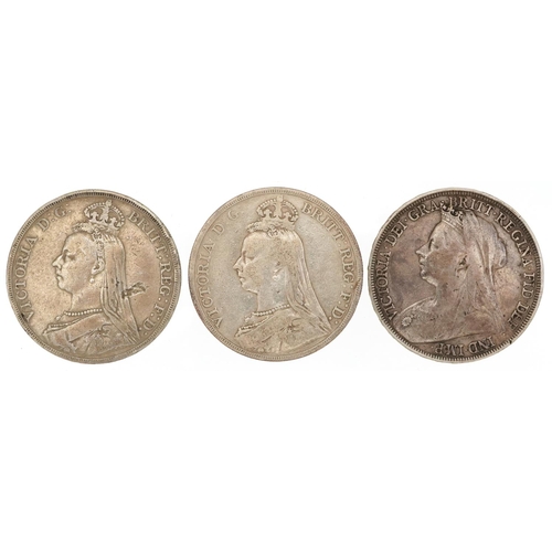 2085 - Three Victorian silver crowns comprising two dated 1889 and one 1897, 83g