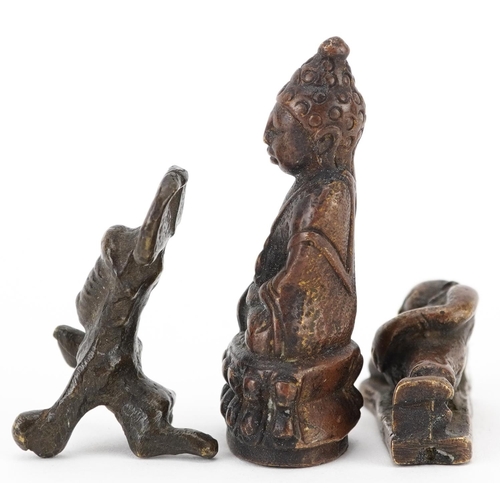 1513 - Three Chinese and Asian patinated bronze figures including an example of seated Buddha, the largest ... 