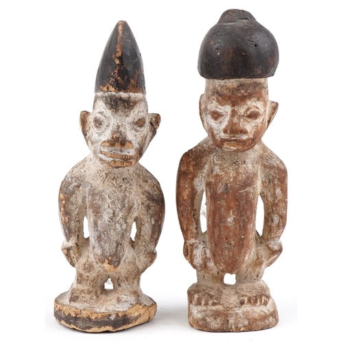 297 - Pair of African tribal interest carved wood figures, the largest 30.5cm high