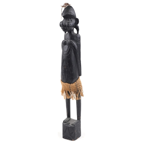 1268 - Large African tribal interest carved wood figure of a tribesman, 63cm high