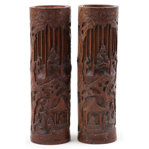 510 - Pair of Chinese cylindrical bamboo vases carved with figures amongst trees and pavilions, each 37cm ... 