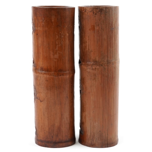 510 - Pair of Chinese cylindrical bamboo vases carved with figures amongst trees and pavilions, each 37cm ... 