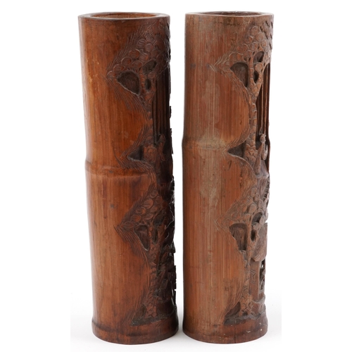 510 - Pair of Chinese cylindrical bamboo vases carved with figures amongst trees and pavilions, each 37cm ... 