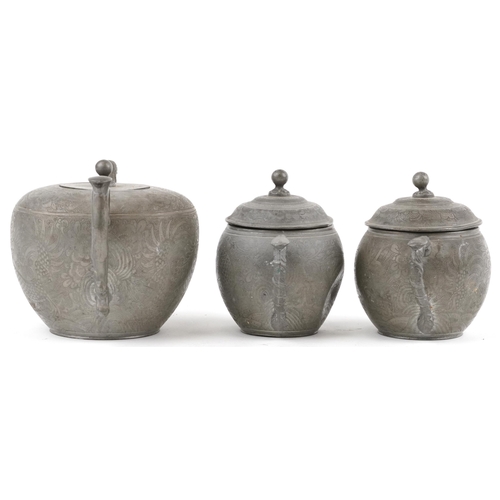 512 - Chinese Swatow Kut Hing pewter three piece tea set comprising teapot, lidded milk jug and lidded sug... 