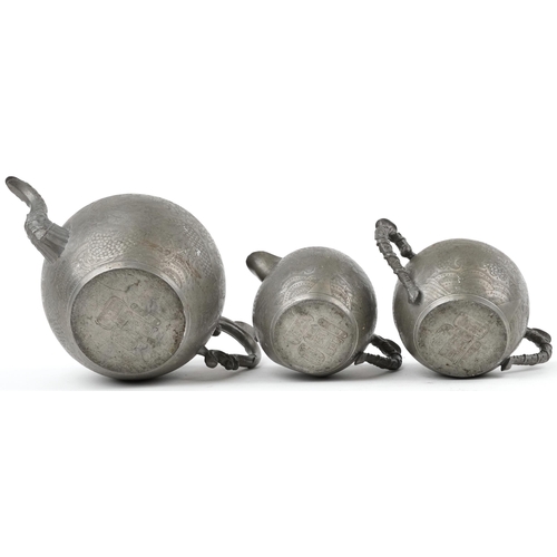 512 - Chinese Swatow Kut Hing pewter three piece tea set comprising teapot, lidded milk jug and lidded sug... 