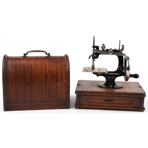 1275 - Early 20th century continental cast iron child's sewing machine with dome top case