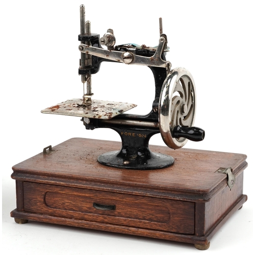 1275 - Early 20th century continental cast iron child's sewing machine with dome top case