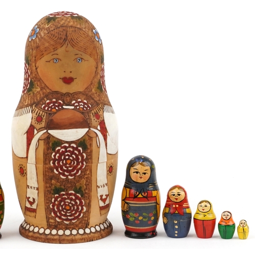 1273 - Three Russian Matryoshka stacking dolls and three lacquered eggs, the largest stacking doll hand pai... 