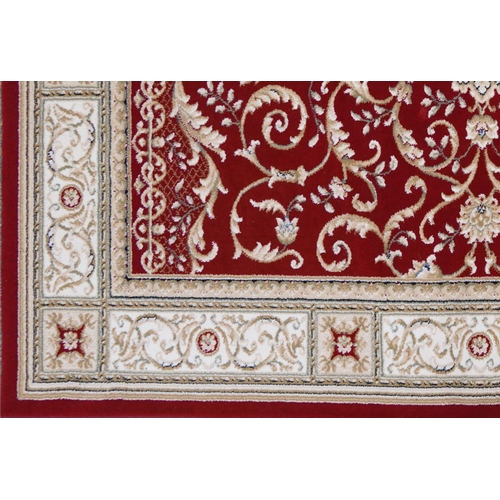 1225 - Rectangular red and cream ground floral rug, 230cm x 160cm