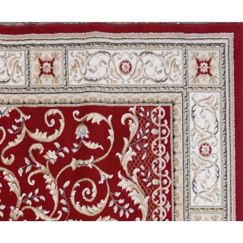 1225 - Rectangular red and cream ground floral rug, 230cm x 160cm