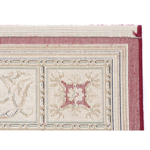 1225 - Rectangular red and cream ground floral rug, 230cm x 160cm