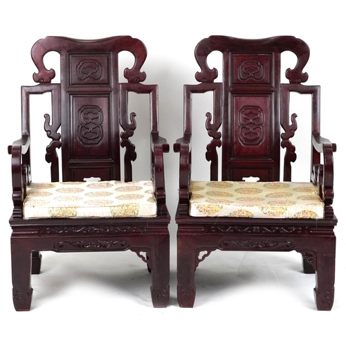 1125 - Pair of Chinese carved hardwood throne chairs with lift of cushioned seats, possibly Hongmu, each 10... 