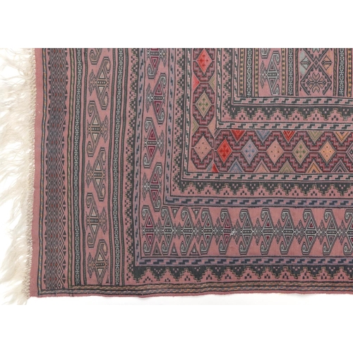 1222A - Rectangular Afghan red ground rug having an allover geometric design within corresponding borders, 1... 