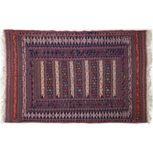 1222A - Rectangular Afghan red ground rug having an allover geometric design within corresponding borders, 1... 