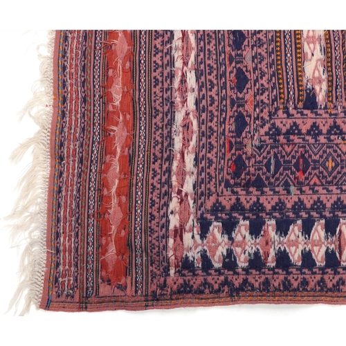 1222A - Rectangular Afghan red ground rug having an allover geometric design within corresponding borders, 1... 