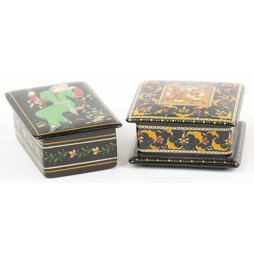 1481 - Two Islamic black lacquered boxes and covers including an example hand painted with flowers, the lar... 