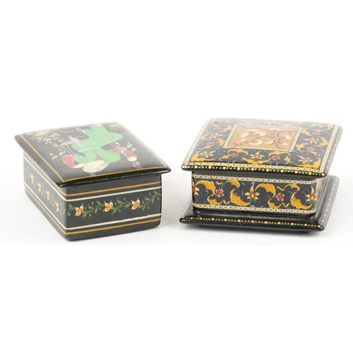 1481 - Two Islamic black lacquered boxes and covers including an example hand painted with flowers, the lar... 