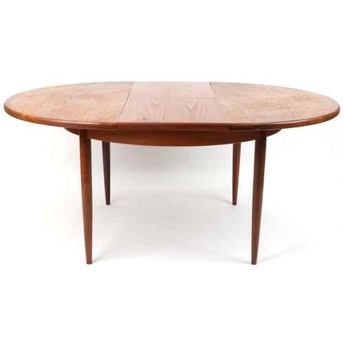 1009 - G Plan, mid century teak Fresco extending dining table, 73cm high x 121cm in diameter when closed