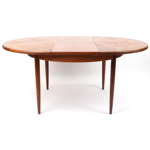 1009 - G Plan, mid century teak Fresco extending dining table, 73cm high x 121cm in diameter when closed