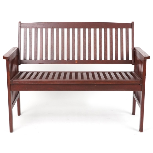 1185 - Stained teak slatted garden bench, 89cm H x 118.5cm W x 58cm D