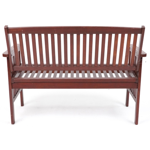 1185 - Stained teak slatted garden bench, 89cm H x 118.5cm W x 58cm D