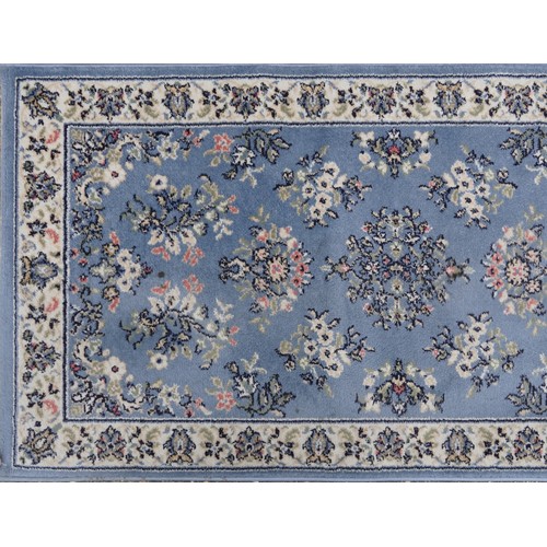 1224 - Three rectangular rugs including a floral Chinese red ground example, the largest 250cm x 80cm