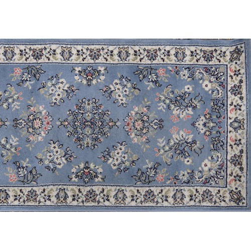 1224 - Three rectangular rugs including a floral Chinese red ground example, the largest 250cm x 80cm