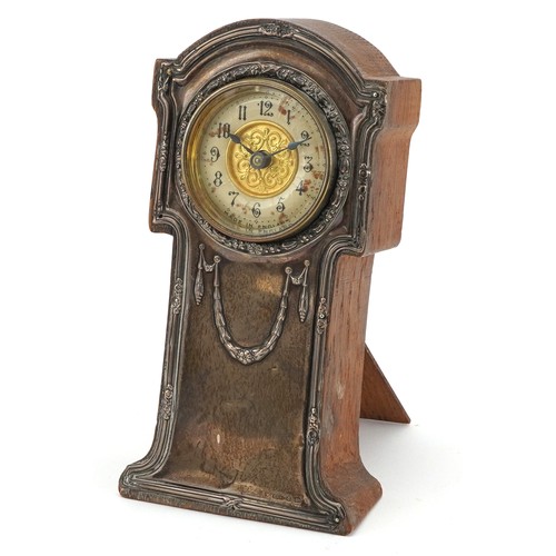 232 - Art Nouveau silver mounted oak strut clock in the form of a longcase clock having enamelled dial wit... 