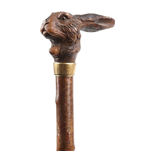 Late 19th century gnarled wood parasol with carved Black Forest hare design mechanical open and close mouth handle, 94cm in length