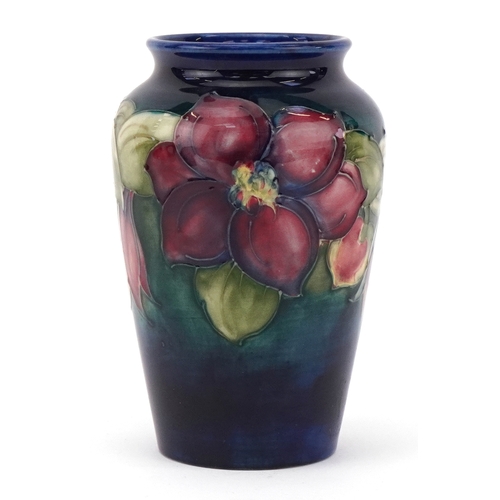 94 - Moorcroft pottery vase hand painted and tubelined in the Anemone pattern, 12.5cm high