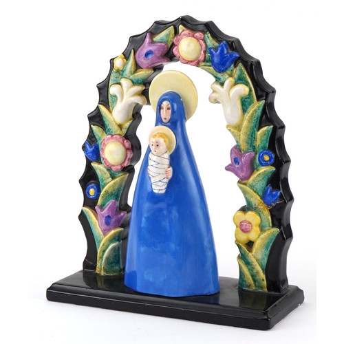 Lenci, Italian Art Deco porcelain statuette of Madonna and child under a floral arch, part paper label and inscription to the base, 25.5cm high