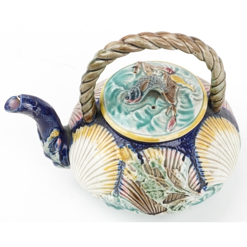 128 - Victorian Majolica teapot decorated in relief with shells and fish, 23cm in length