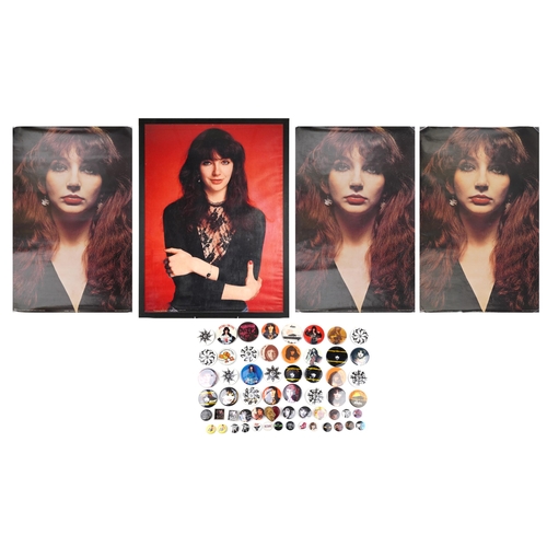 Kate Bush memorabilia comprising three posters, one framed and vintage badges, the largest 95cm x 72cm