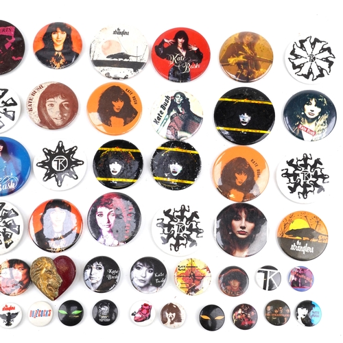 1277 - Kate Bush memorabilia comprising three posters, one framed and vintage badges, the largest 95cm x 72... 