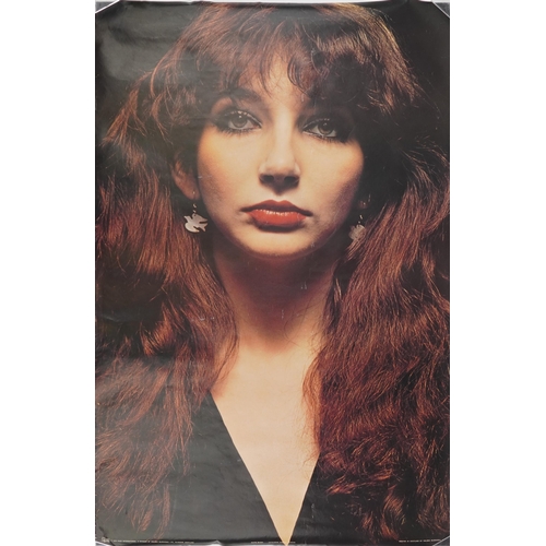 1277 - Kate Bush memorabilia comprising three posters, one framed and vintage badges, the largest 95cm x 72... 